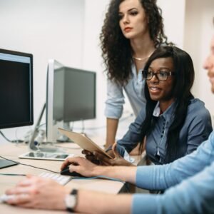 Programmers cooperating at information technology company